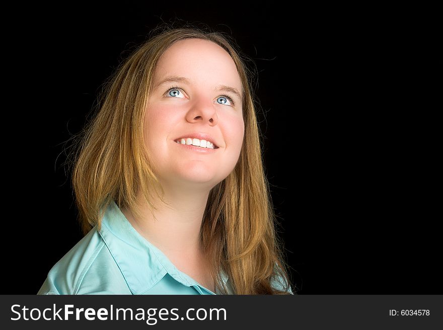 Attractive blond woman with blue eyes look up.