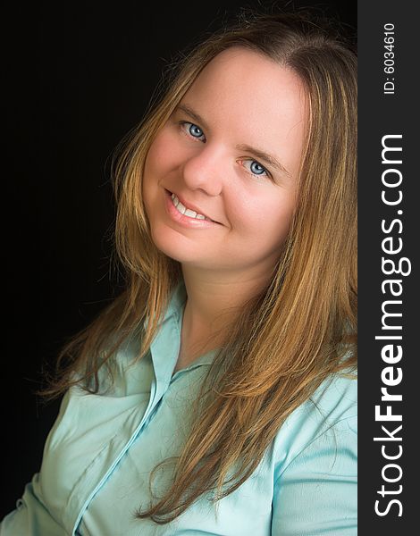 Portrait of an attractive blond woman with blue eyes.