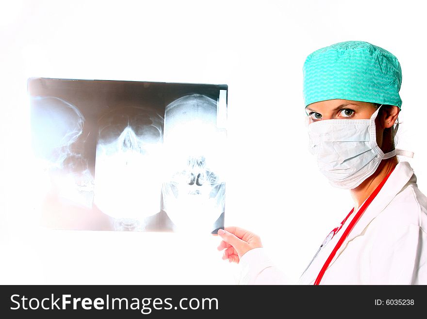 A beautiful young doctor with a red stethoscope and a xray image in the back. Isolated over white. High-key image!. A beautiful young doctor with a red stethoscope and a xray image in the back. Isolated over white. High-key image!