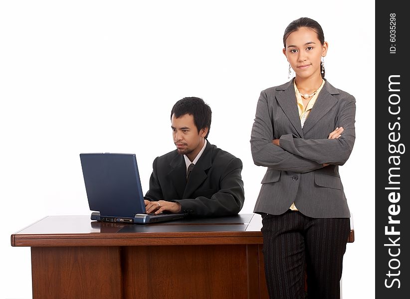 Portrait of beautiful secretary standing infront of her boss table