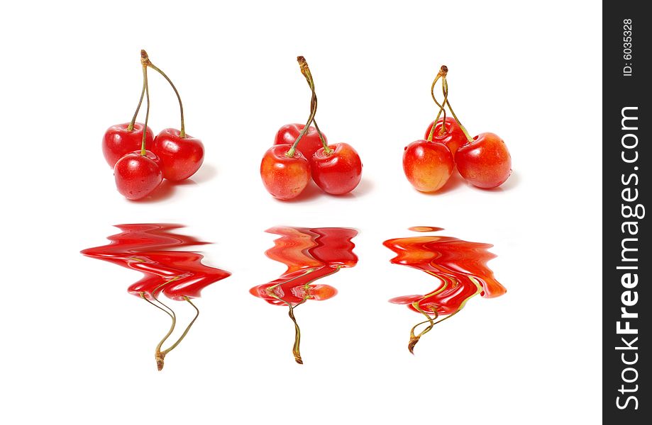 Three clusters of a sweet cherry with reflection. Three clusters of a sweet cherry with reflection