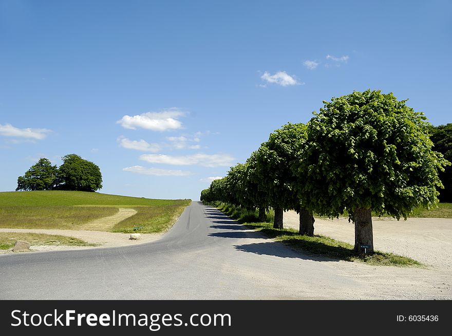 Road at the contryside with blu and cloudy sky. Road at the contryside with blu and cloudy sky.