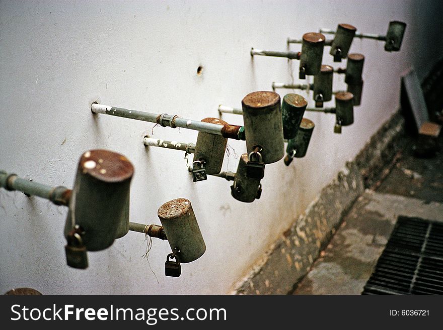 Some old city of china, no enough apartment,so several family reside in one house.They lock the water faucets avoiding used by others,one faucet belong to one family. Some old city of china, no enough apartment,so several family reside in one house.They lock the water faucets avoiding used by others,one faucet belong to one family.