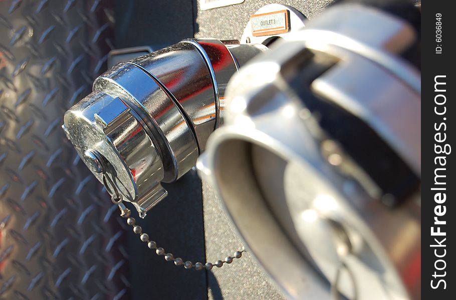 A close-up of fire truck hose valves. A close-up of fire truck hose valves