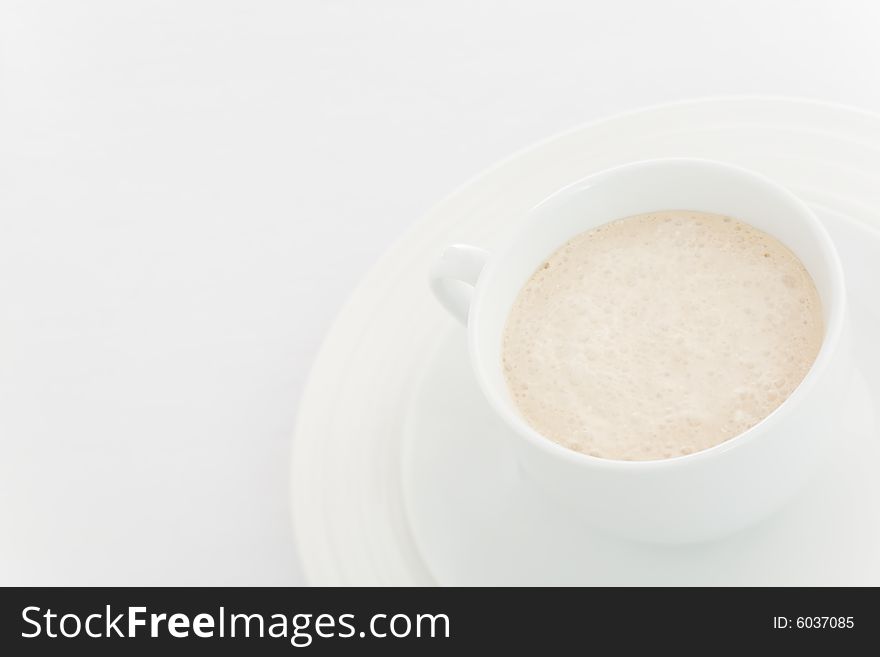 White coffee  (latte) cup over a white background. White coffee  (latte) cup over a white background