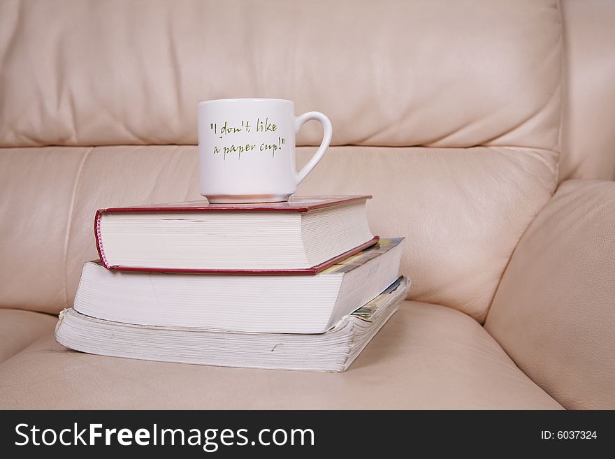 A cup of coffee on book