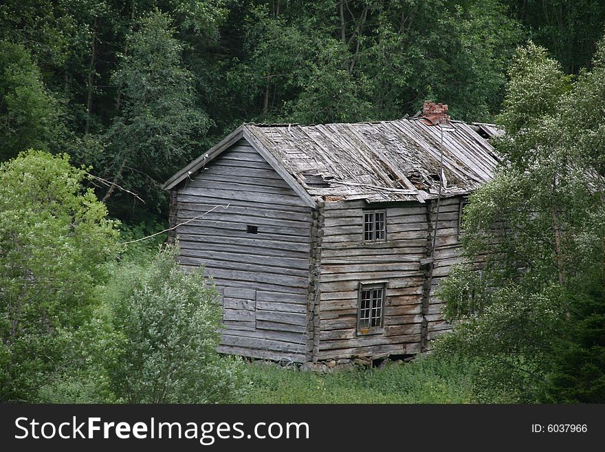 Spooky, gray, rotten house in a wood. Spooky, gray, rotten house in a wood