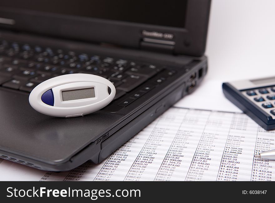 Security token on the small notebook and pen. Security token on the small notebook and pen