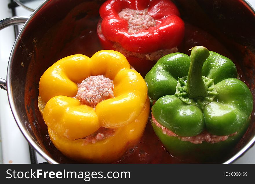 3 colourful paprikas filled with pork meat. 3 colourful paprikas filled with pork meat
