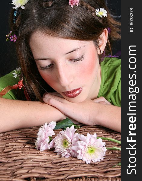 Teenage model with flowers and butterflies in her hair. Teenage model with flowers and butterflies in her hair