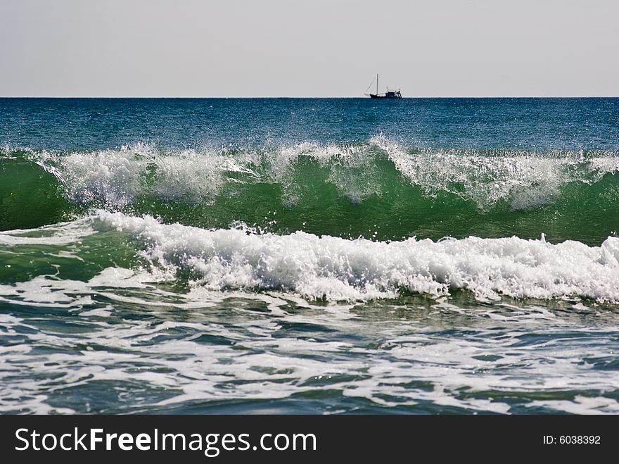 Black Sea waves in foreground with ship on horizon. Black Sea waves in foreground with ship on horizon