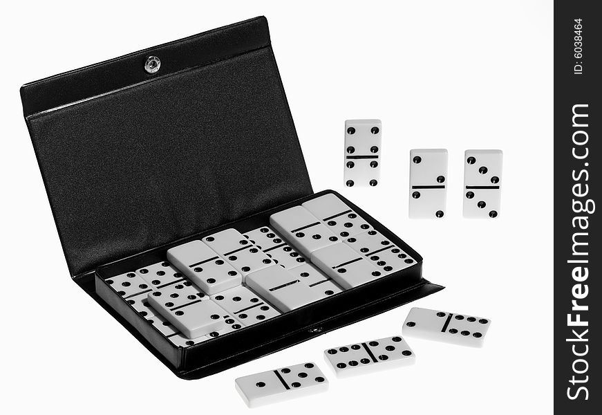 Dominoes on white background, close up