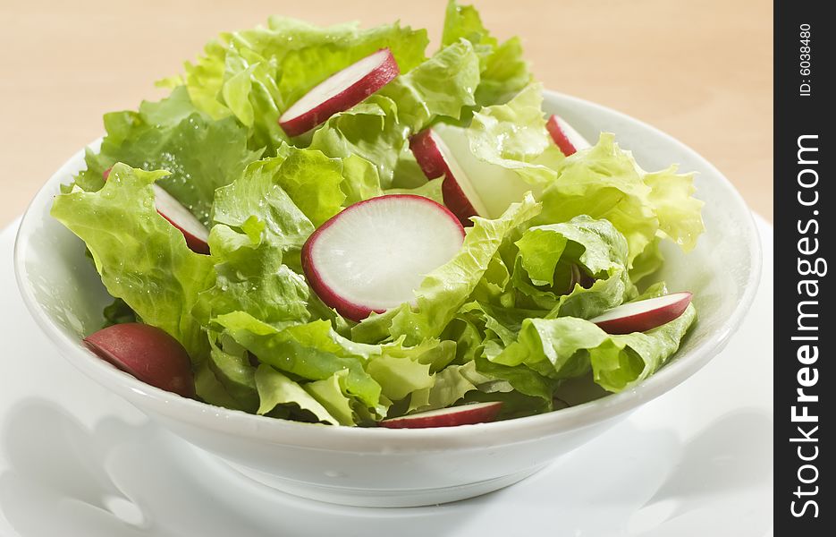 Fresh green salad with radish close up
