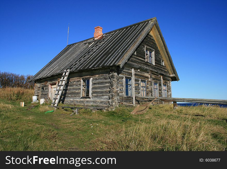 Old lodge in village in Russia