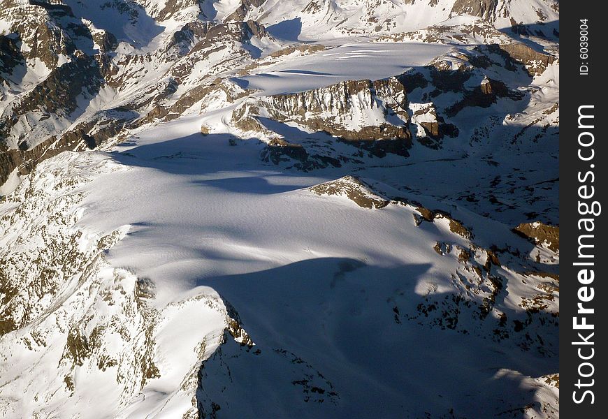 Snow scene of the Alps mountains, taken  during a flight over the border between France and Italy. Snow scene of the Alps mountains, taken  during a flight over the border between France and Italy