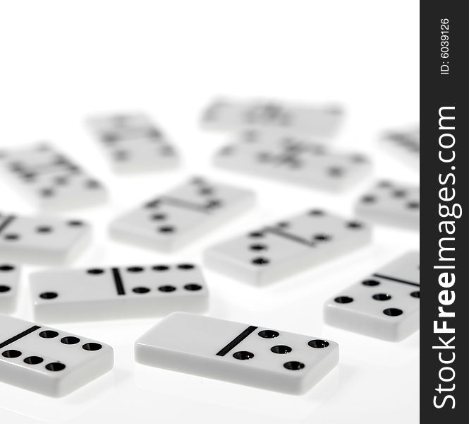 Dominoes on white background, close up