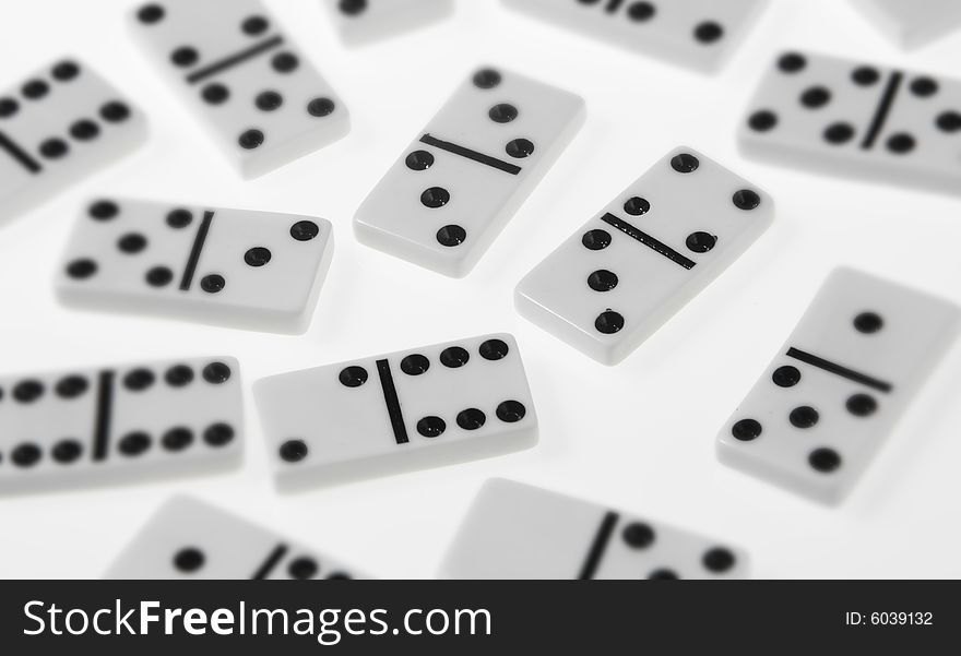 Dominoes on white background, close up