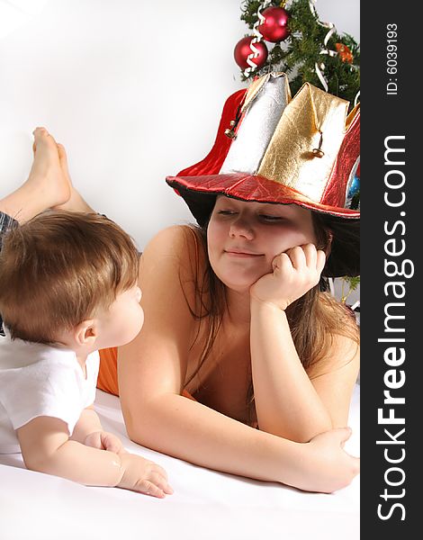 Brother and Sister with  fool`s cap at Christmas. Brother and Sister with  fool`s cap at Christmas