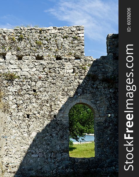 Beach view through old castle window