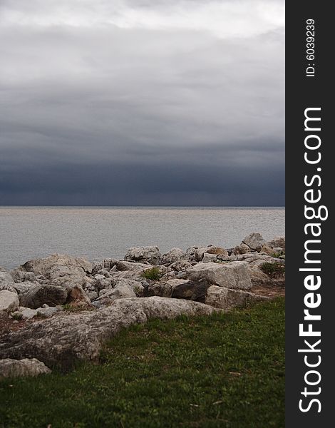 The shoreline of Lake Ontario on a cloudy day. The shoreline of Lake Ontario on a cloudy day
