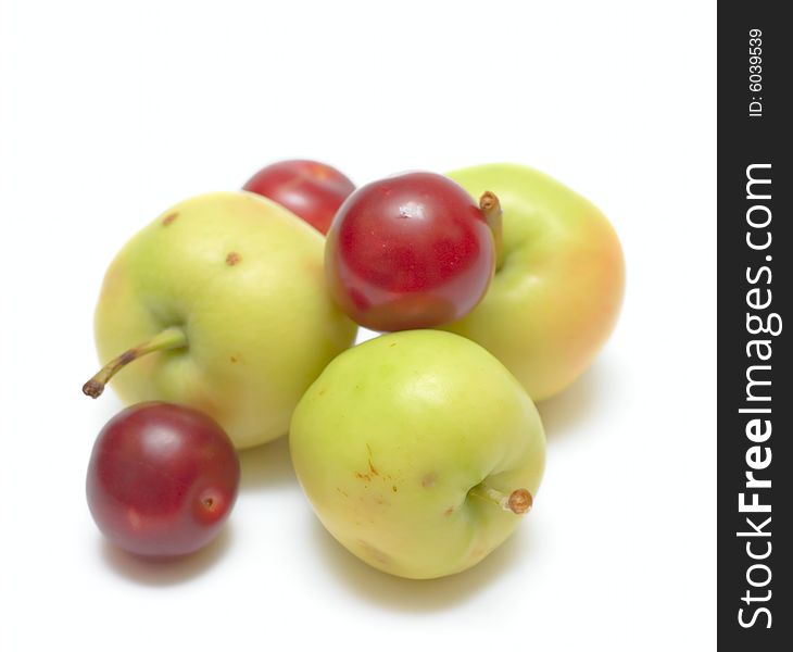 Apples and plums isolated on white for your design