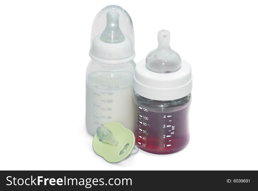 Bottles with milk and juice on a white background