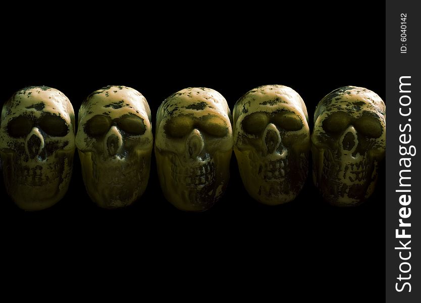 A row of five skulls on isolated black. A row of five skulls on isolated black.