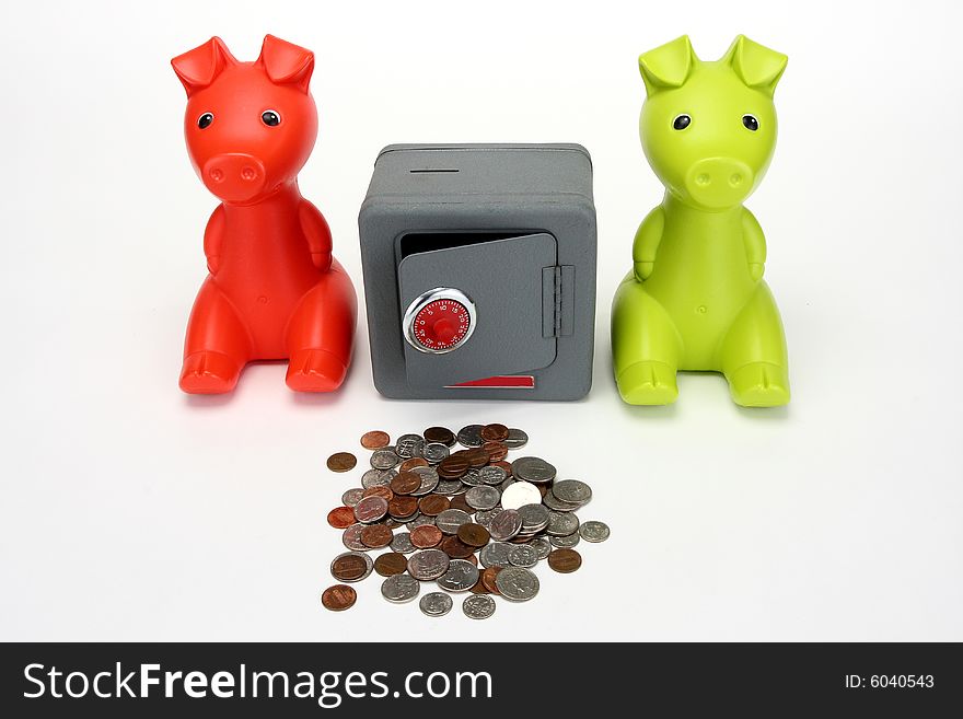 Red and Green Piggy banks guarding a combination safe. Red and Green Piggy banks guarding a combination safe.