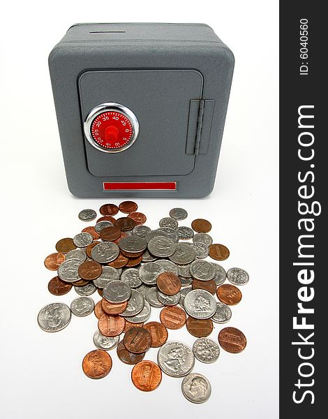 Safe with red combination dial and lots of coins. Safe with red combination dial and lots of coins
