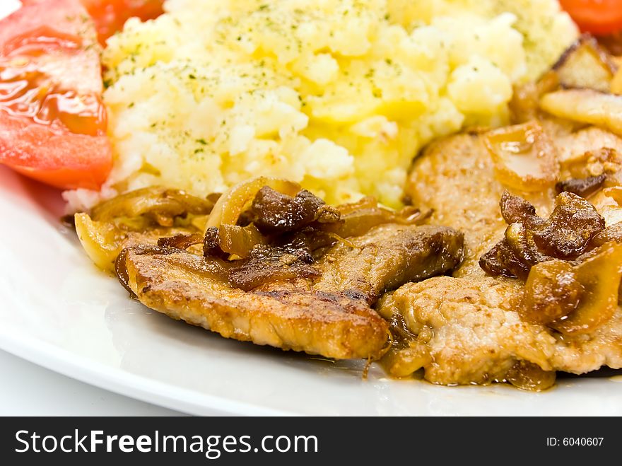 Roasted pork cutlet with puree and tomato salad