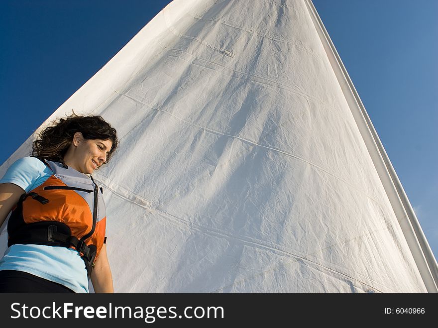 Woman Standing Against Sail on Boat - Horizontal