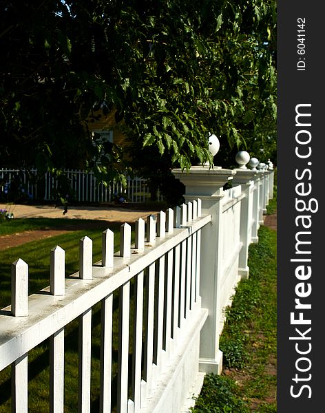 Classic new england picket fence stretching off into the distance. Classic new england picket fence stretching off into the distance