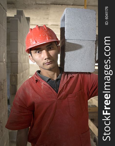 Worker Stares At Camera. Vertically Framed Photo.