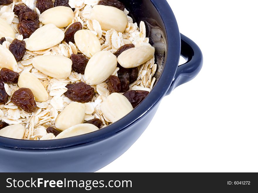 A bowl of oatmeal with raisins and almonds - healthy diet