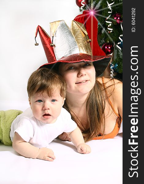 Brother and Sister with  fool`s cap at Christmas. Brother and Sister with  fool`s cap at Christmas