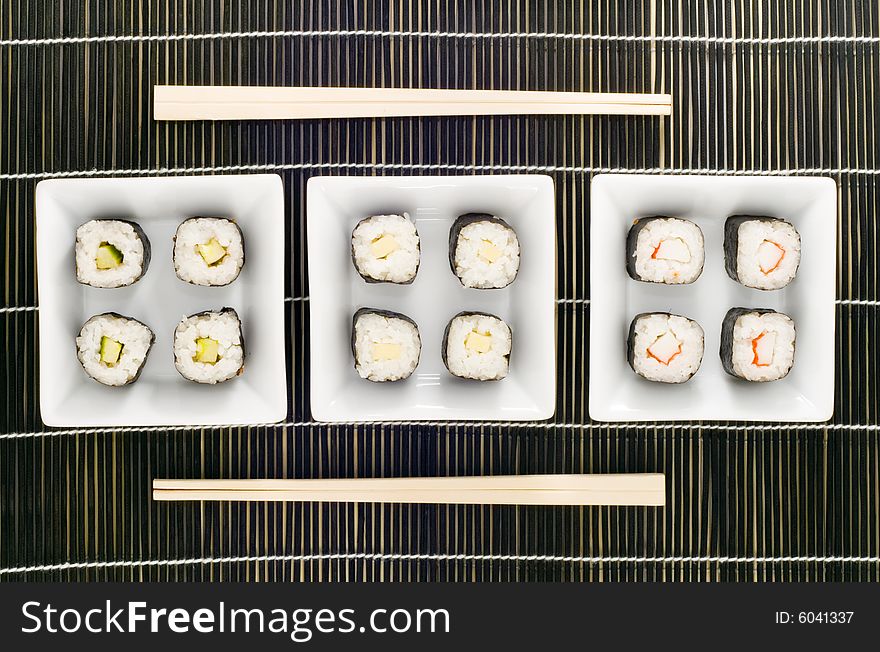 Three plates with different kinds of sushi