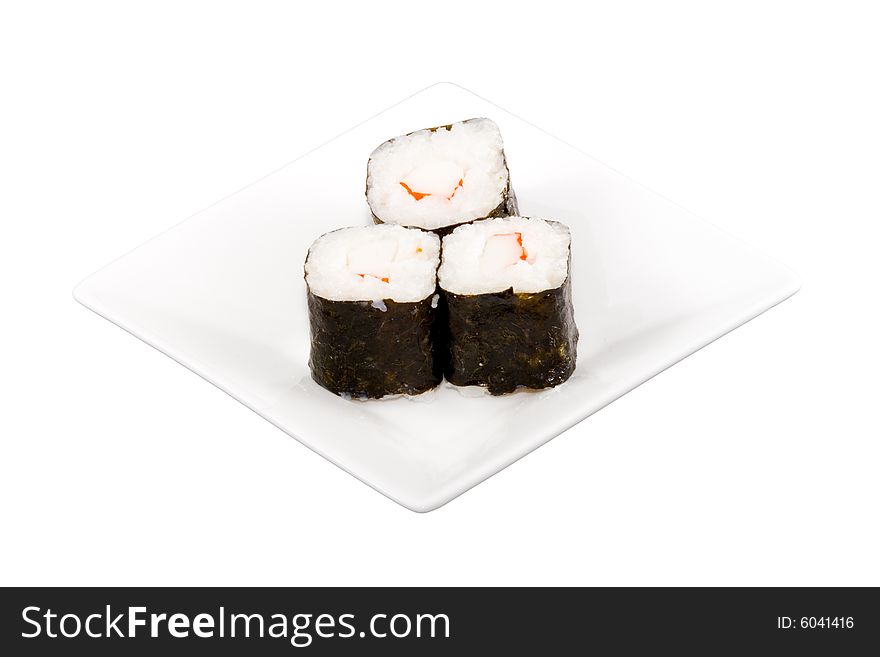 A square white plate with three pieces of sushi