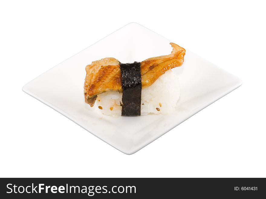 A square white plate with a piece of sushi