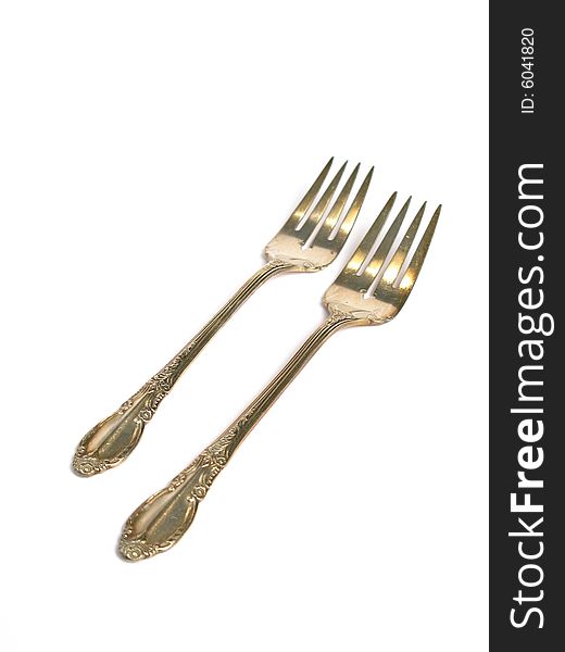 Old forks for different uses on a white background