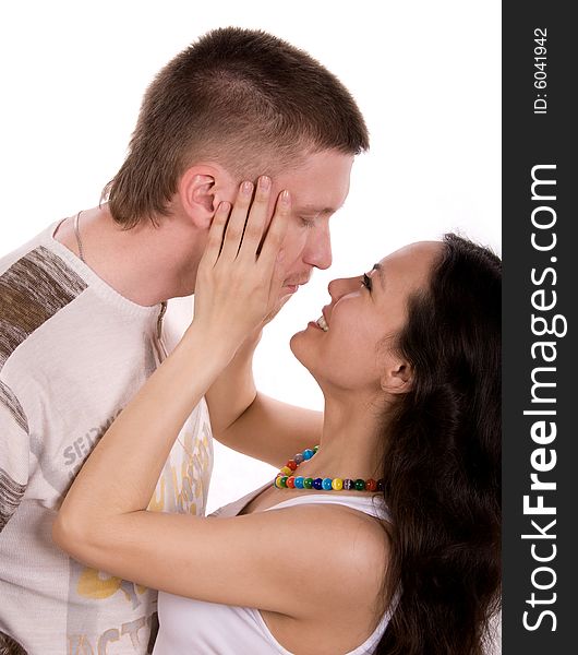 Loving young couple against white background. Loving young couple against white background