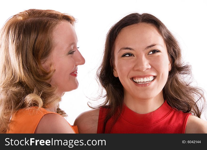 Two young gossiping girls against white background