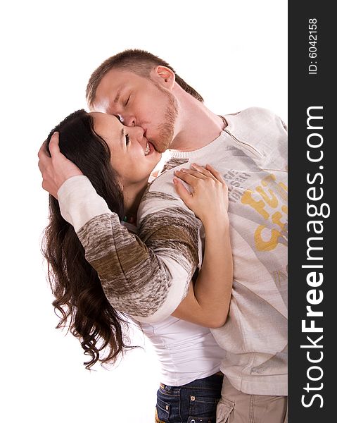 Loving young couple against white background. Loving young couple against white background