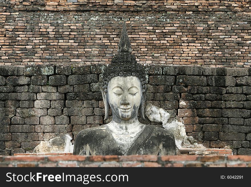 A buddha face in a historical park in inland Thailand