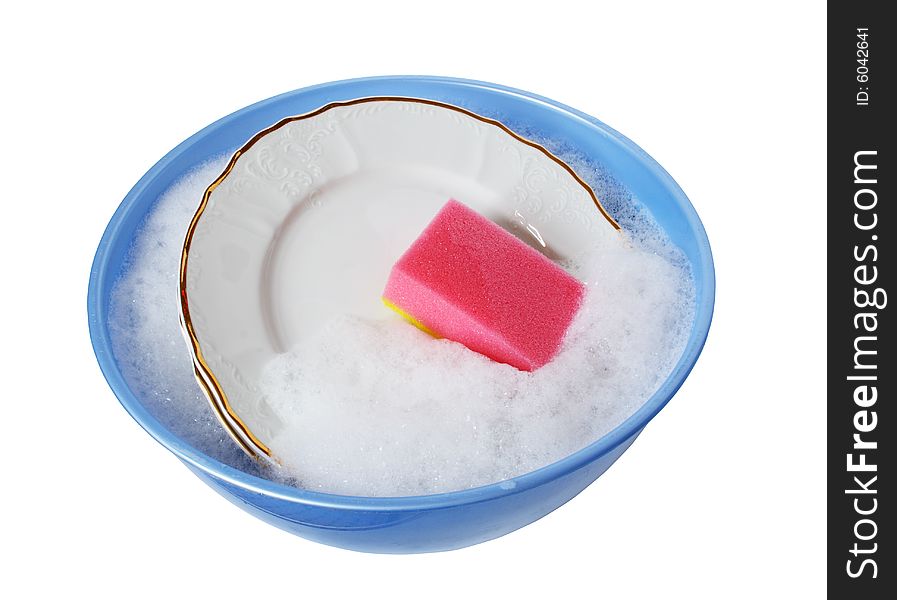 White plates and pink sponge lying in blue wash-basin with water and foam. White plates and pink sponge lying in blue wash-basin with water and foam