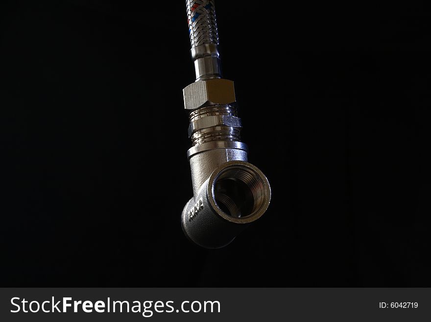 Close-up of modern water-pipe with nipples on dark background. Close-up of modern water-pipe with nipples on dark background