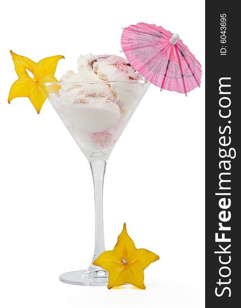 Ice-cream with slice of carambola in a glass on a white background. Ice-cream with slice of carambola in a glass on a white background.