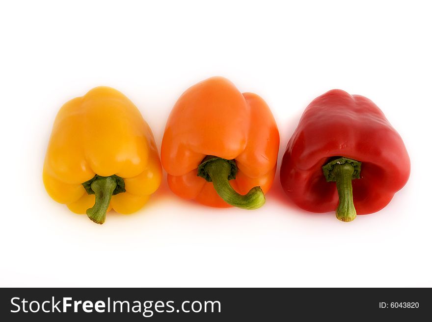 Three red peppers on the white background. Three red peppers on the white background