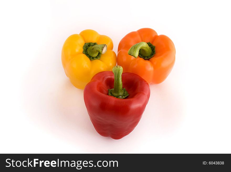 Three red peppers on the white background. Three red peppers on the white background