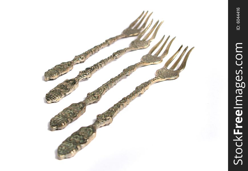 Old forks for different uses on a white background