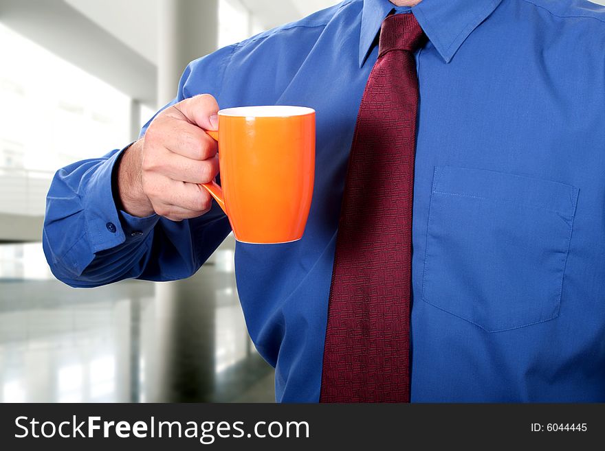 Men having a cup of coffee at work. Men having a cup of coffee at work